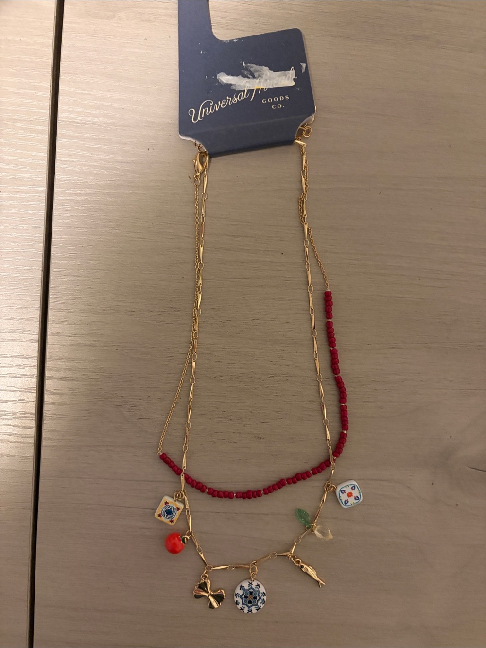 Universal Thread Gold-Tone Necklace with Red Beads and Multicolor Charms